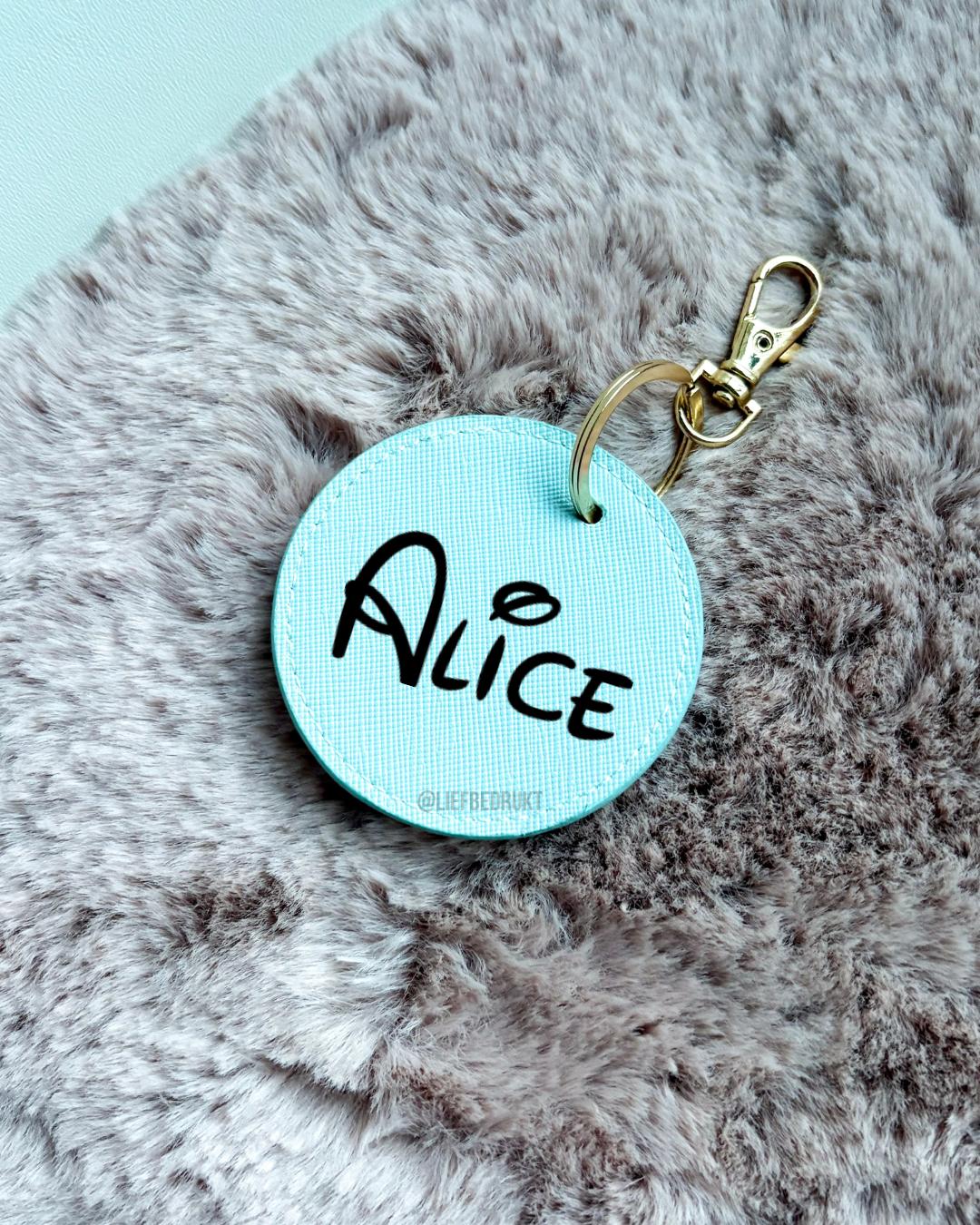 Sleutelhanger rond met naam of tekst  – lederlook