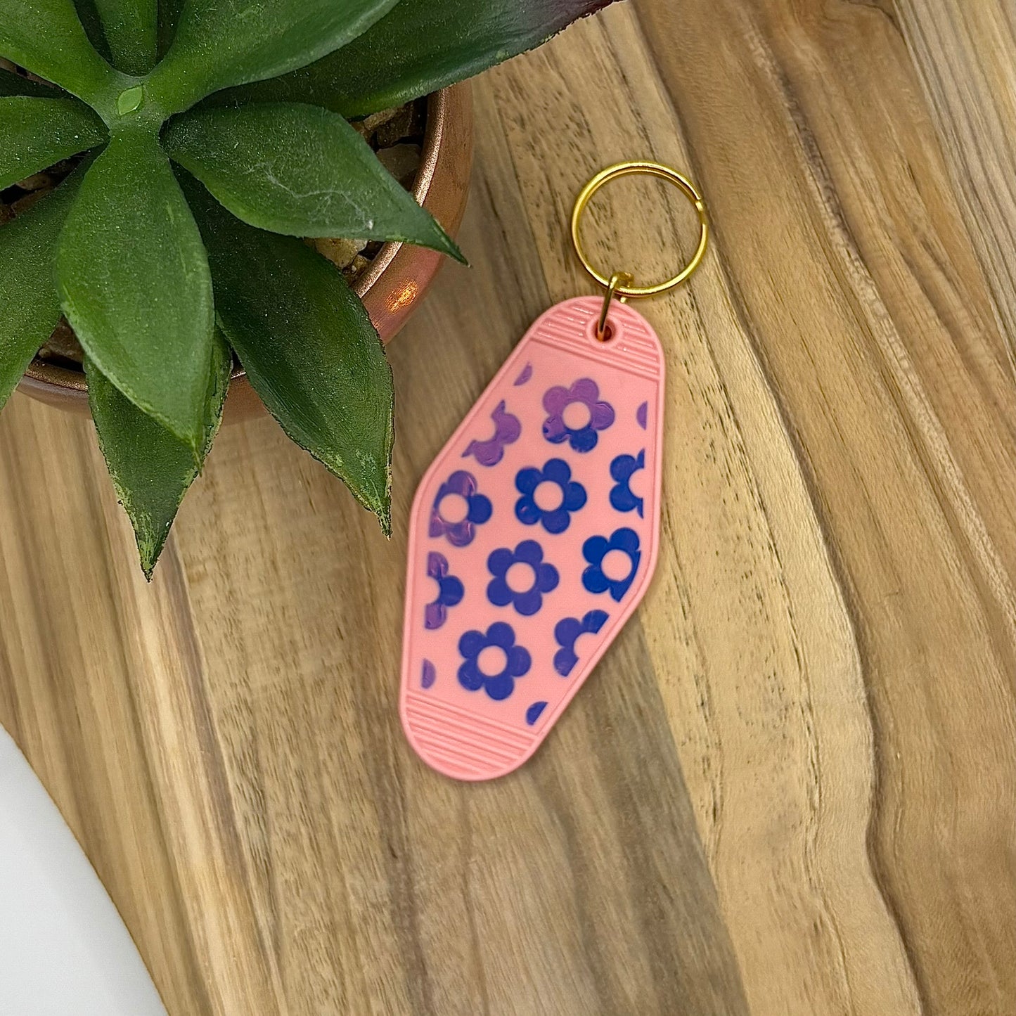 Sleutelhanger met holografische bloemen- hard plastiek